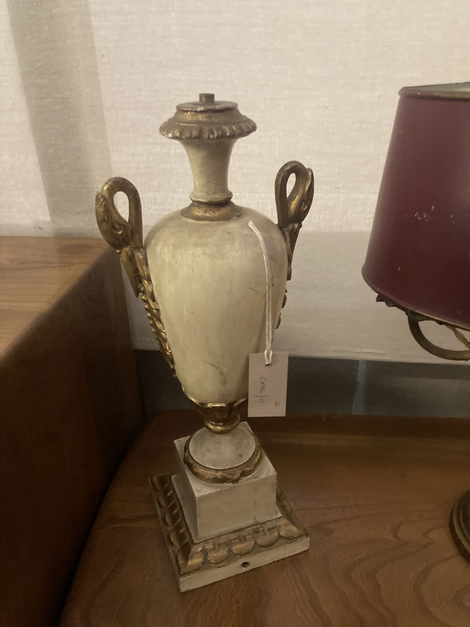 A brass table lamp with toleware shade, height 56cm, together with a parcel gilt painted wood table lamp
